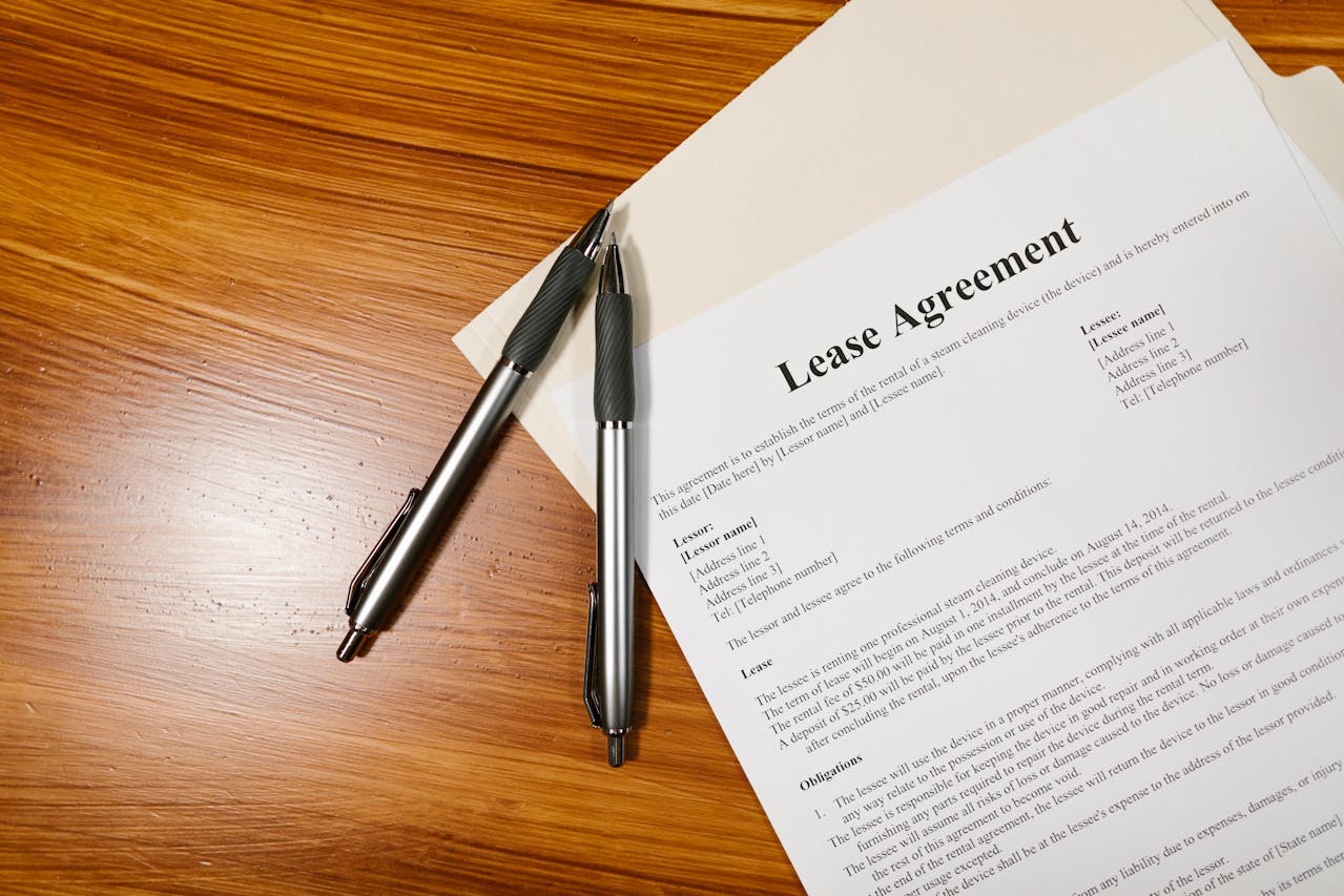 lease document on wood table with fancy pen